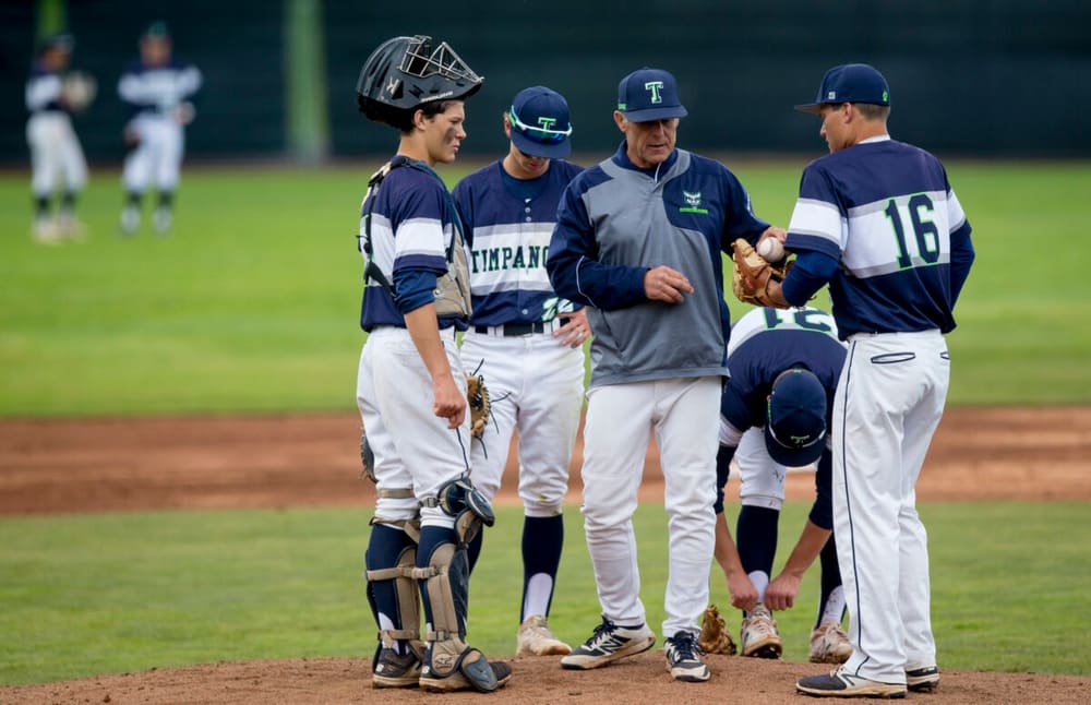 Timpanogos coach making a pitching change on the mound